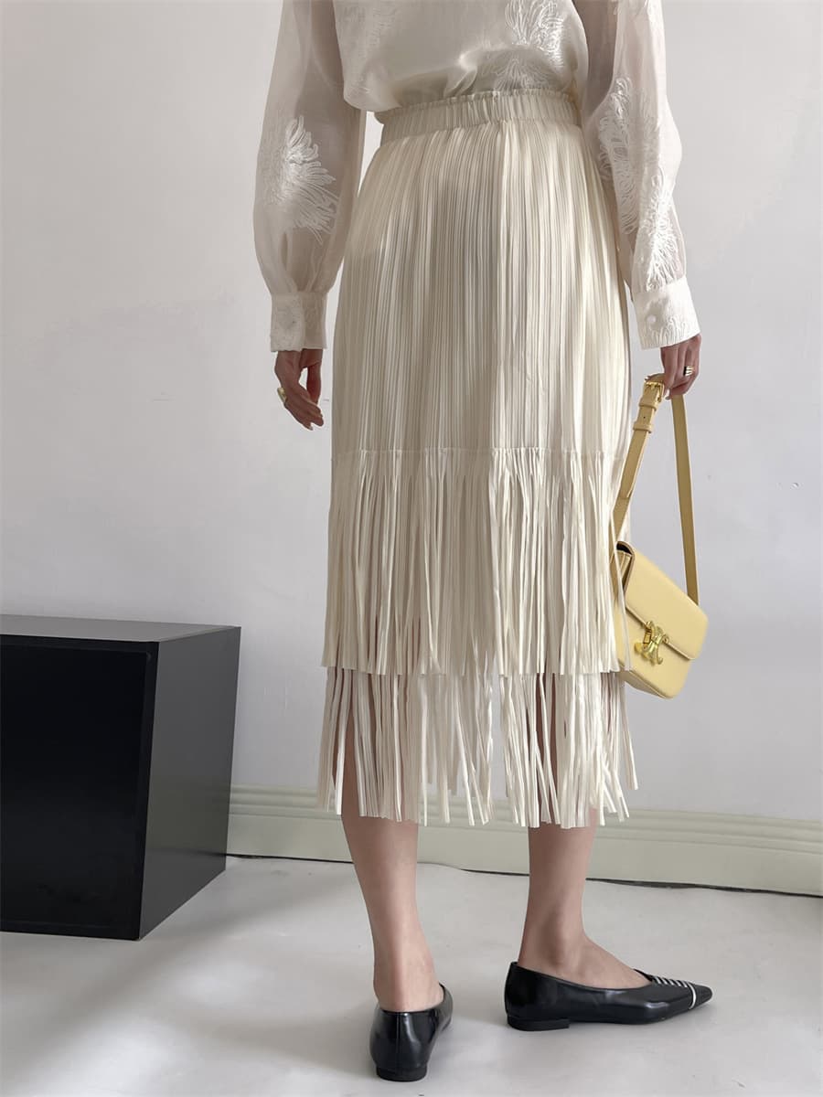 白スカート 流れるフリンジプリーツスカート