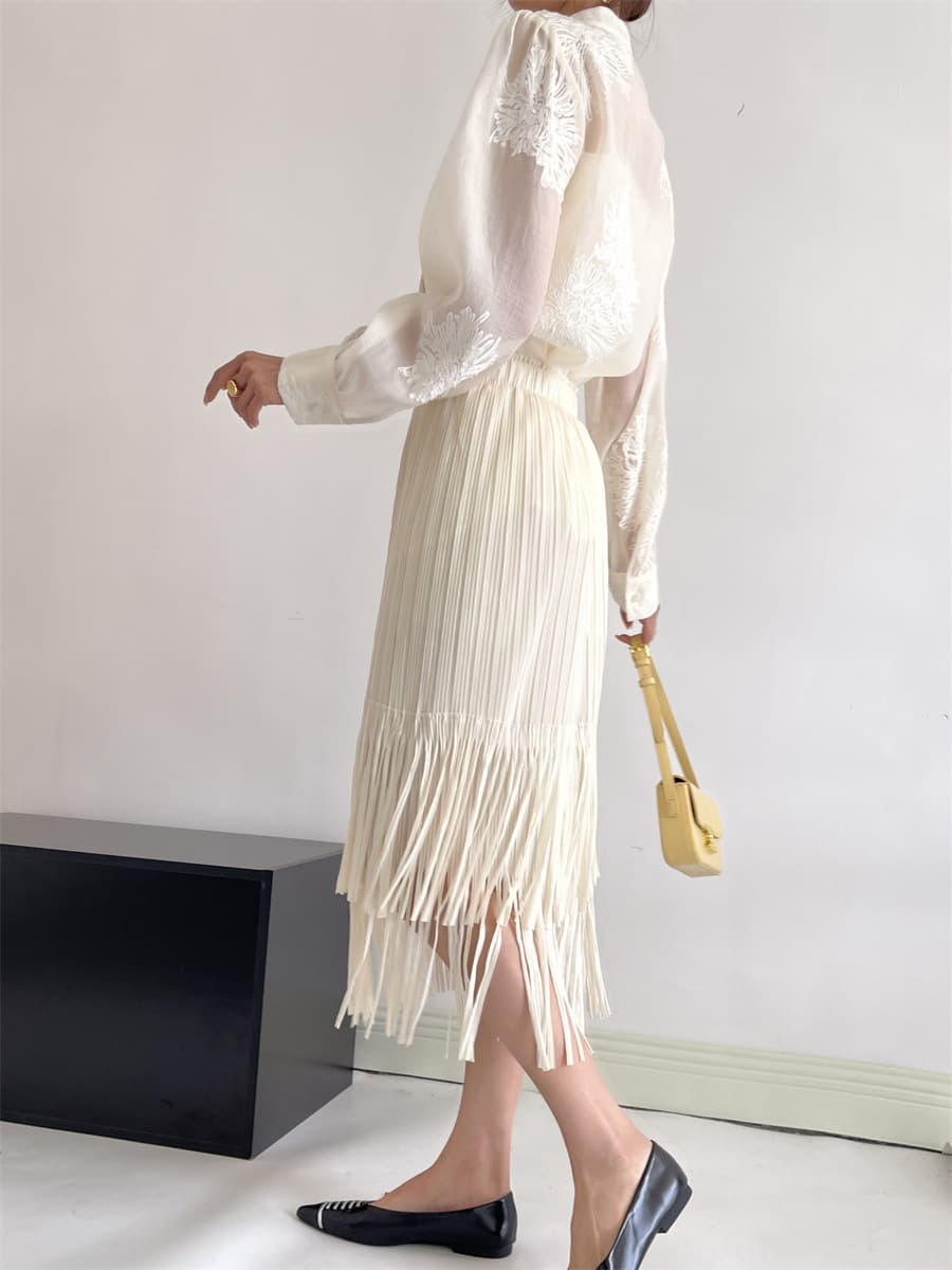 白スカート 流れるフリンジプリーツスカート