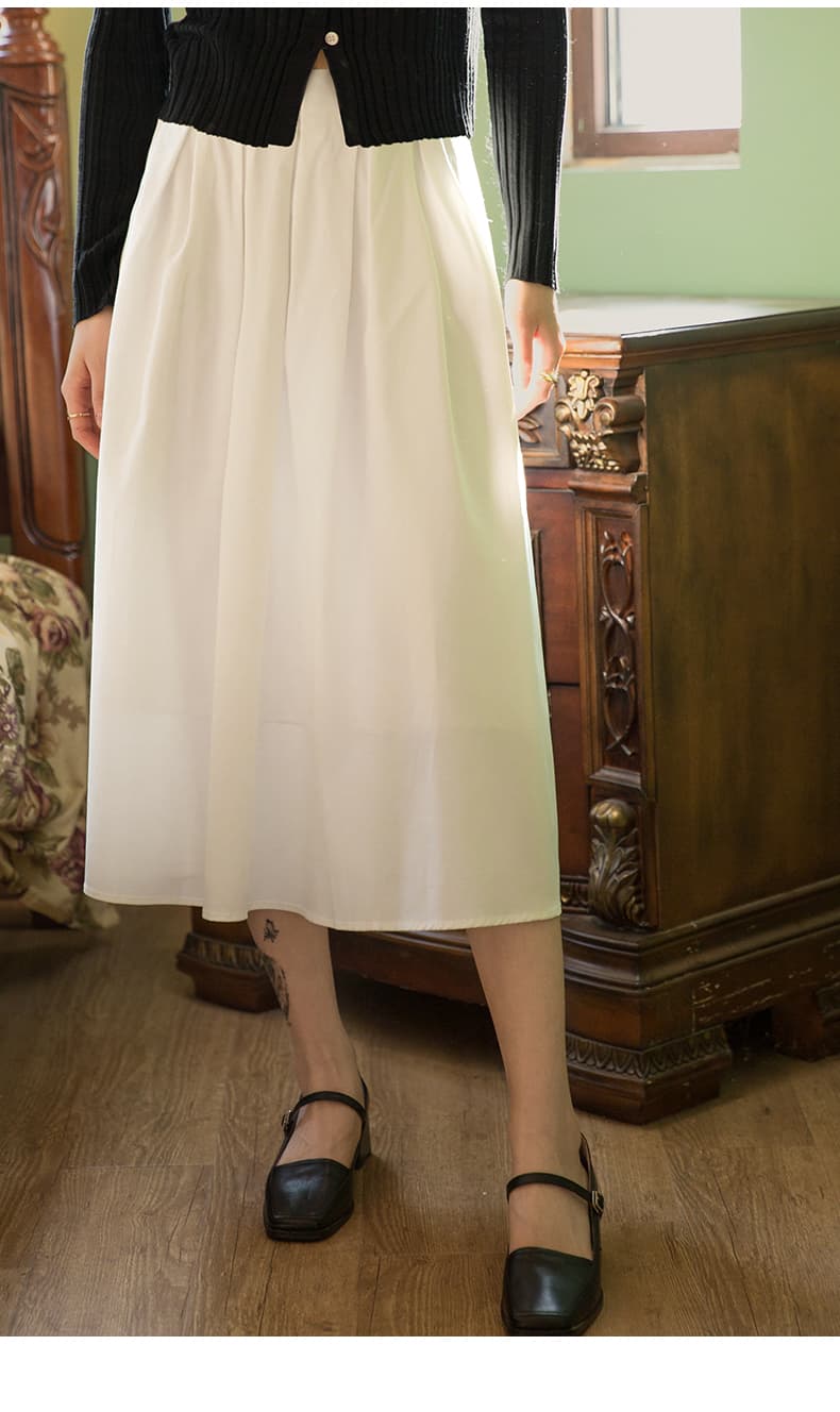 白スカート 優美なミディ丈プリーツスカート