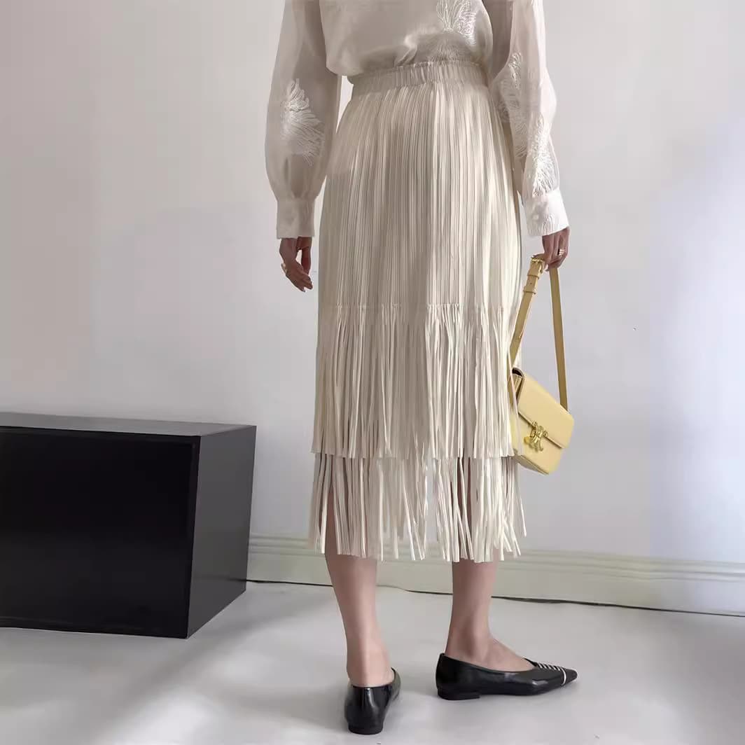 白スカート 流れるフリンジプリーツスカート