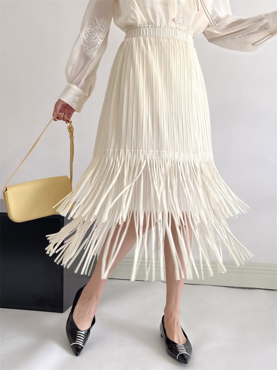 白スカート 流れるフリンジプリーツスカート